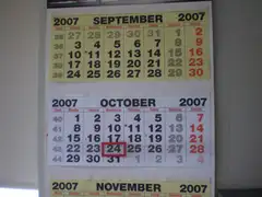 Wall calendar with month pages for September, October and November 2007, with October 24 marked by a red square frame